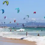 Tarifa beach crowded in Los Lances with a lot of kite.