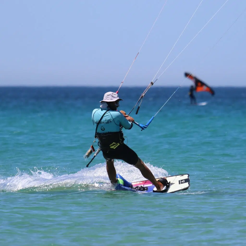 Independent kitesurfer riding upwind after completing their IKO Level 3 certification with Freeride Tarifa.